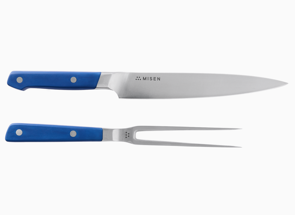 Misen carving set including a carving knife with a blue handle and a carving fork with a blue handle.