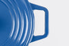 Right side of blue Misen Dutch Oven with Grill Lid seen from above on a white background.