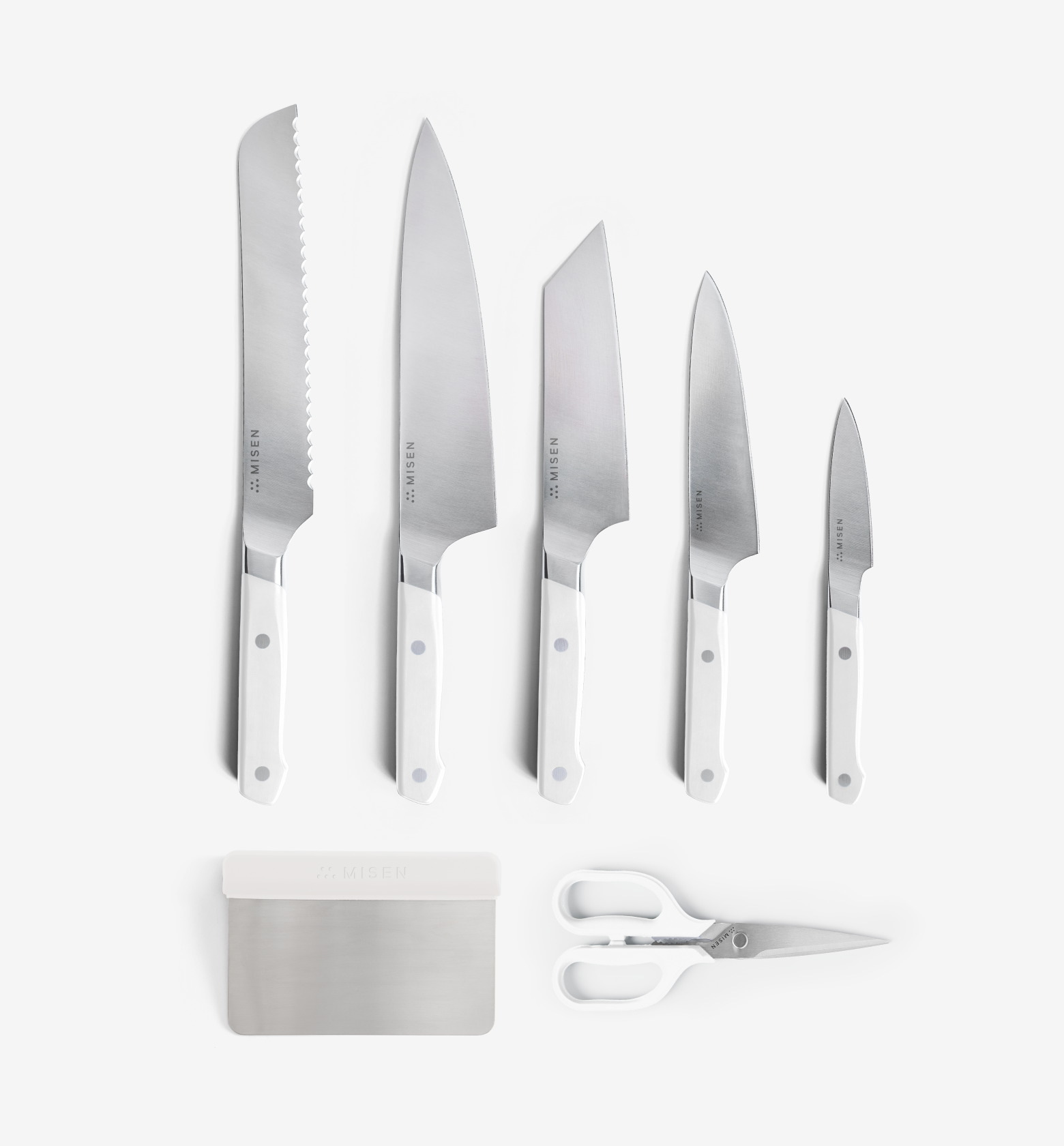 Misen 7-piece kitchen knife set with white handles including bread, chef, santoku, utility, and paring knives plus bench scraper and shears