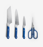 Misen 4-piece knife set with blue handles including chef's knife, santoku, paring knife, and kitchen shears