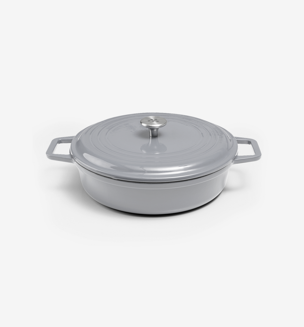 Grey enameled cast iron shallow casserole dish with lid and dual handles