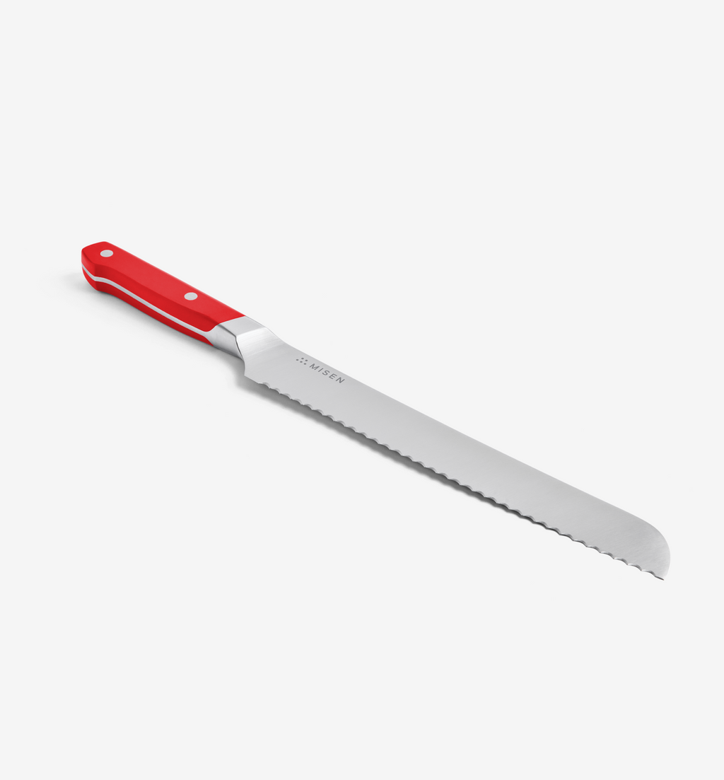 Misen bread knife with red handle and serrated stainless steel blade