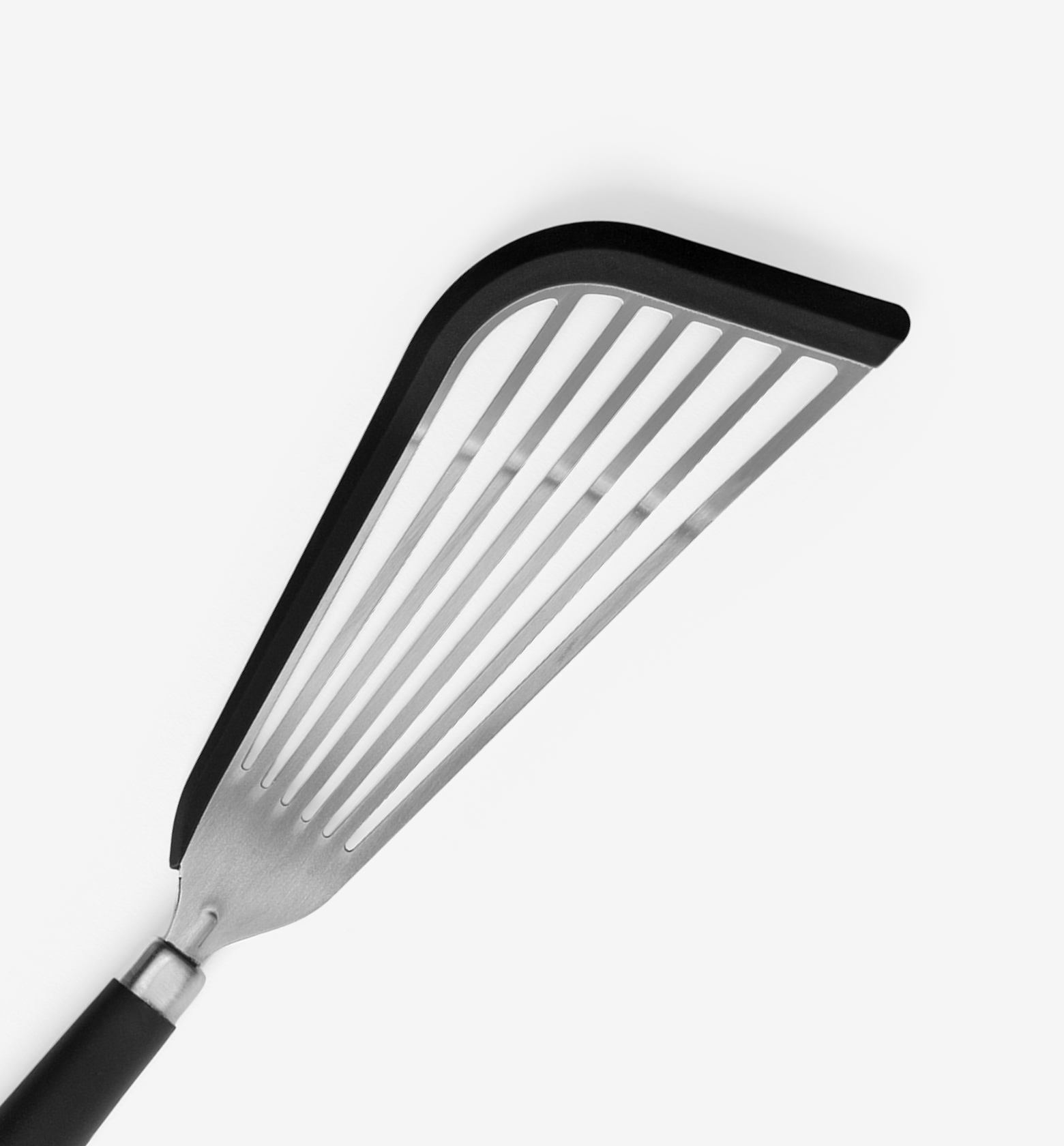 Slotted stainless steel spatula with black silicone edge and rubber handle