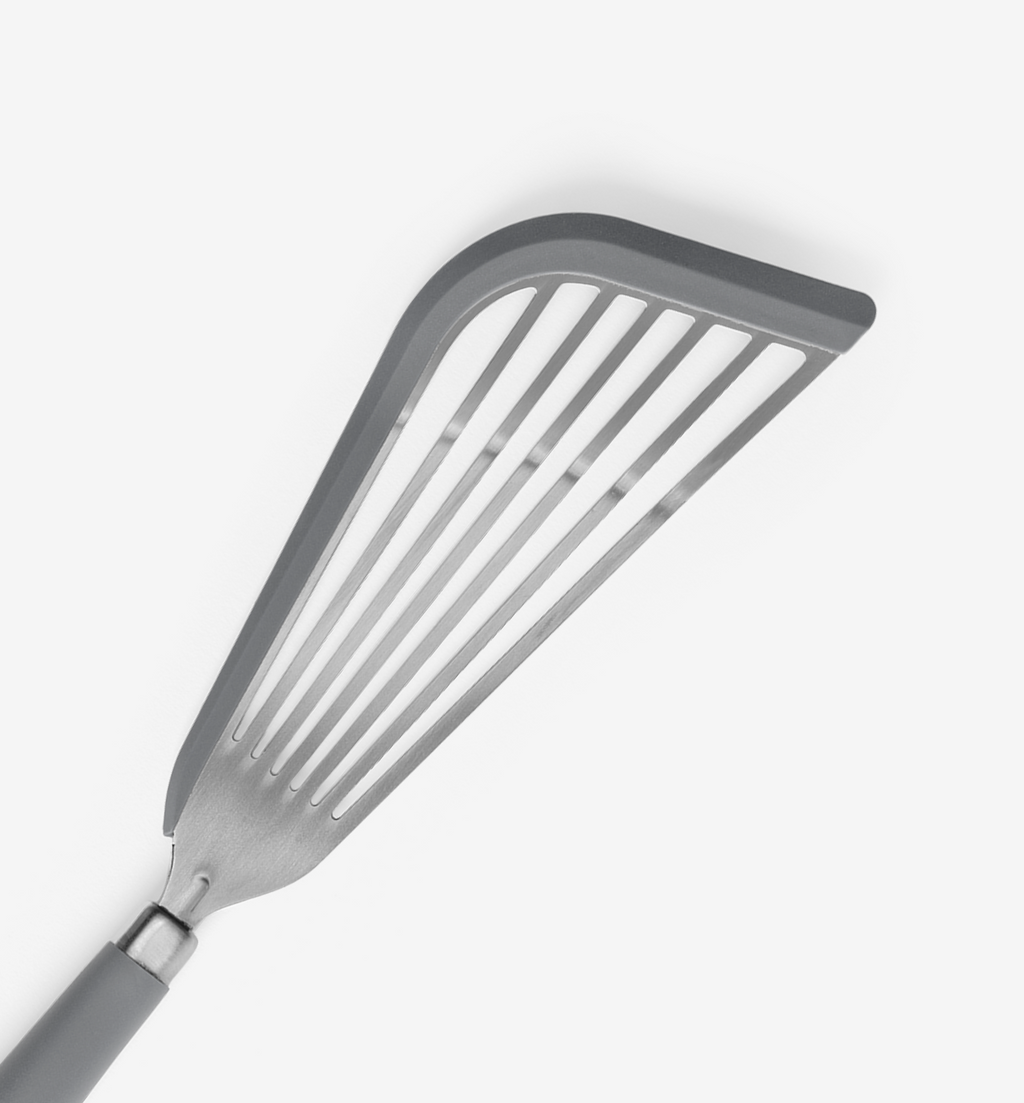 Slotted spatula with flexible head and ergonomic gray handle