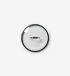 Glass pot lid with stainless steel handle and black silicone rim, top view