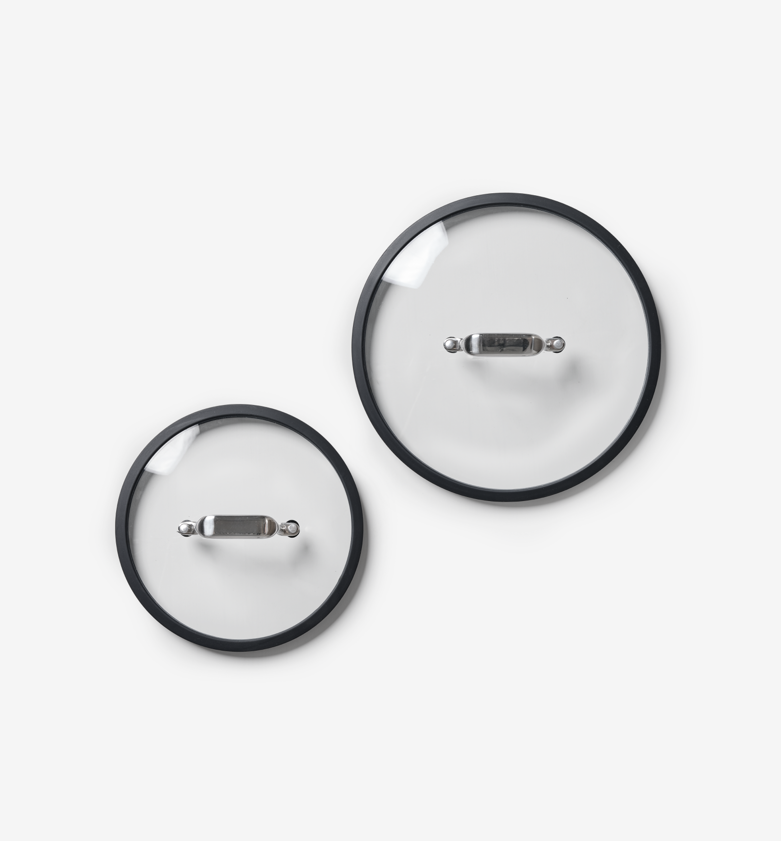 Glass pot lids with stainless steel handles and silicone rims, two sizes