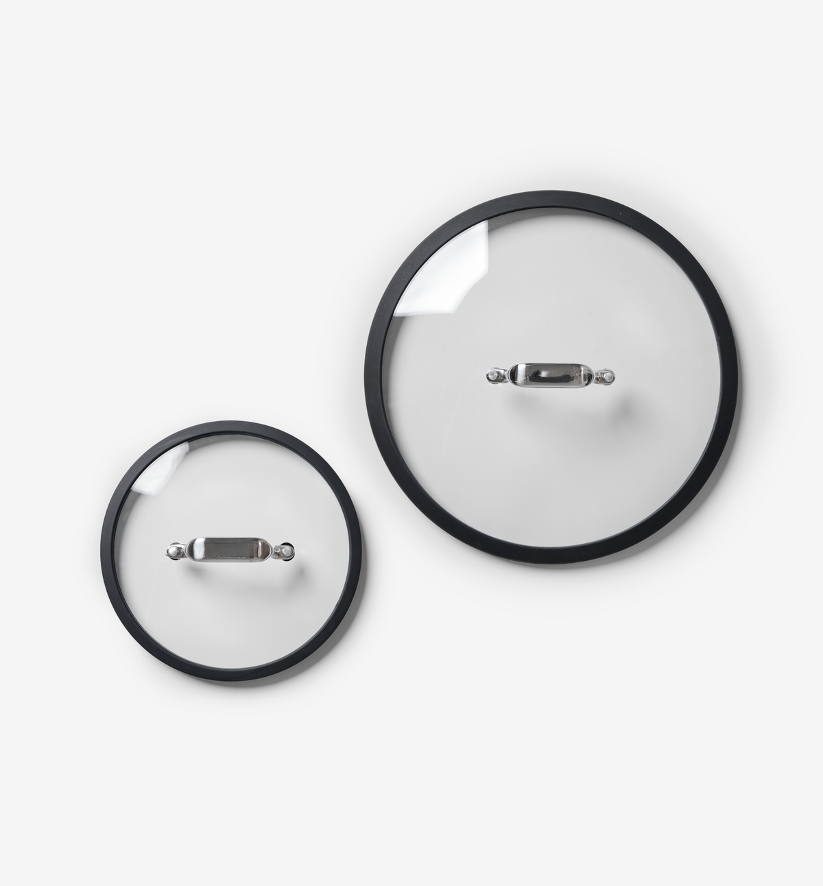 Glass pot lids with black silicone rim and stainless steel handle, two sizes