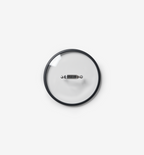 Glass cookware lid with stainless steel handle and black silicone rim, top view