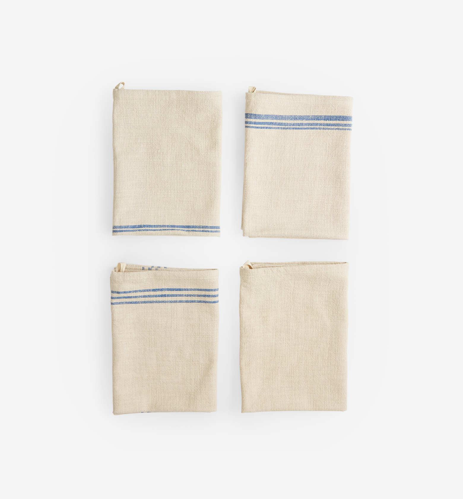 Set of four folded linen kitchen towels with blue stripe detail