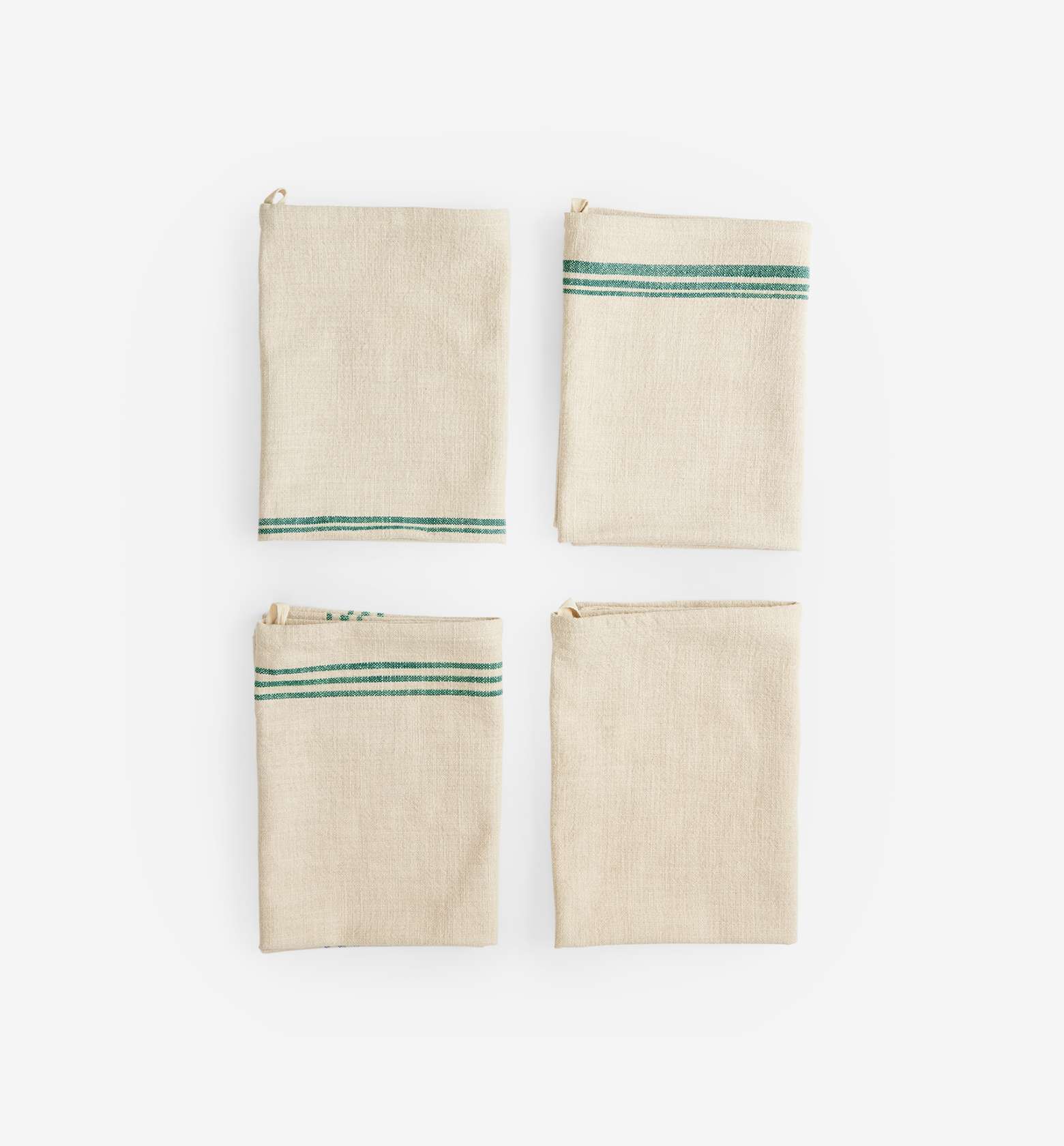 Set of 4 natural linen kitchen towels with green stripe detail, folded flat lay