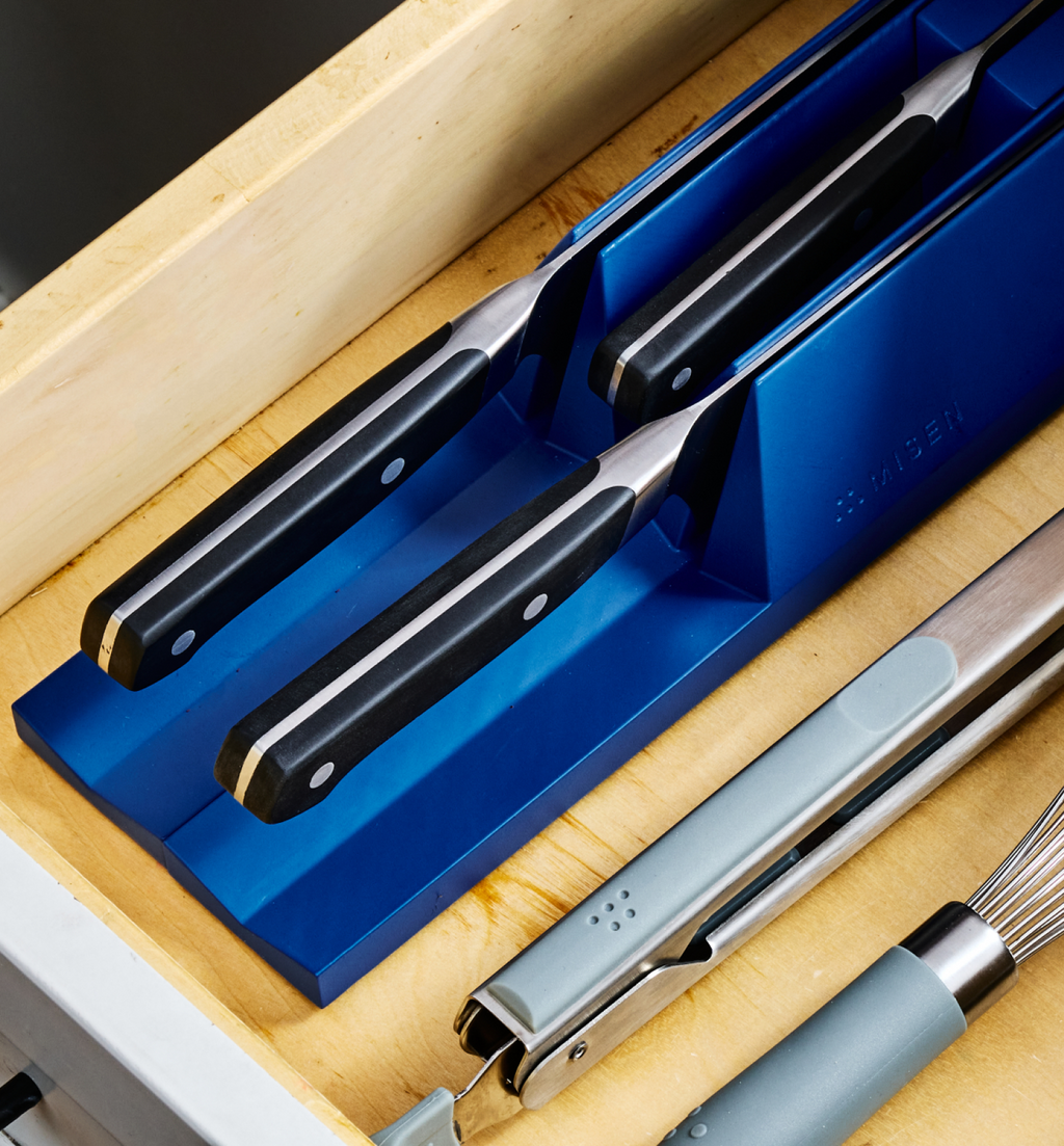 Miden in-drawer knife organizer holding three kitchen knives in blue foam block