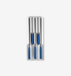 Set of four steak knives with blue handles stored in a stainless steel knife block drawer organizer