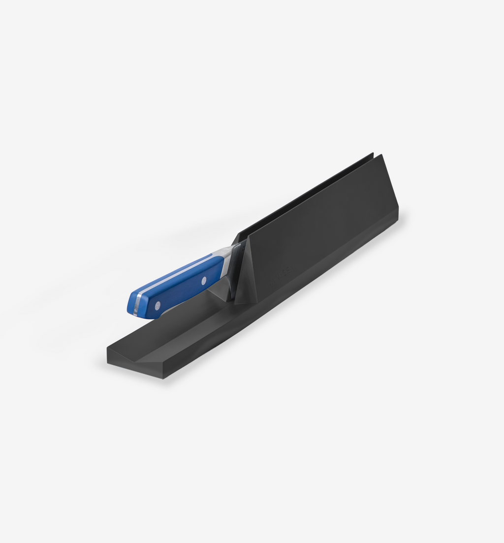 Black drawer knife storage organizer with blue-handled kitchen knife inserted in slot