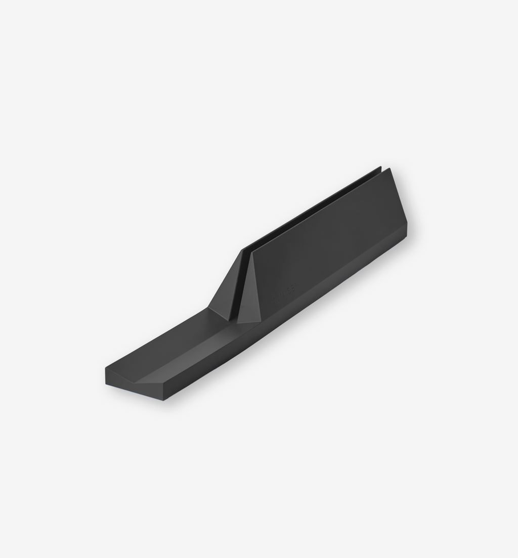 Matte black angular cabinet pull handle with geometric design
