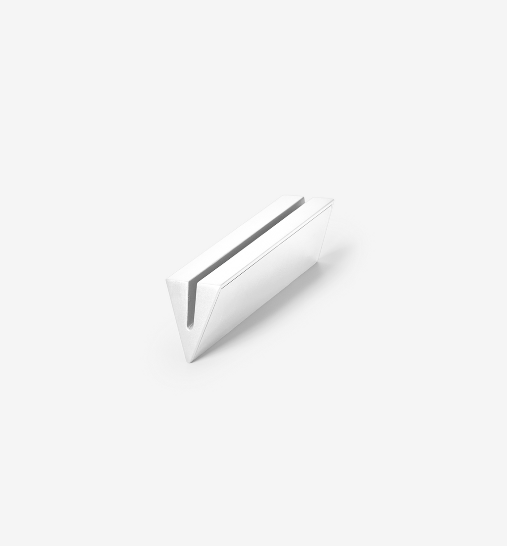 White minimalist card holder or laptop stand with V-shaped slot