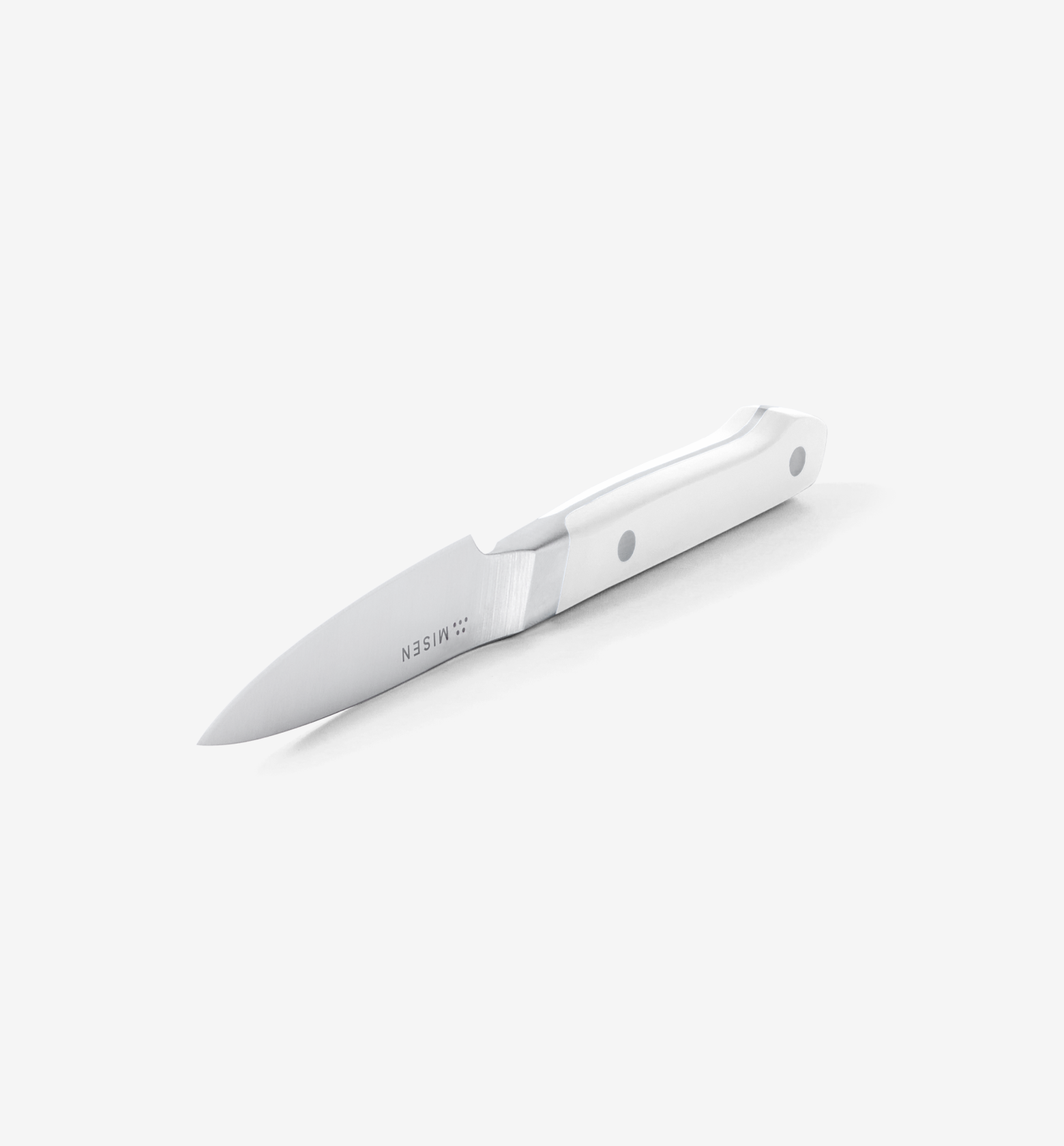 Misen paring knife with white handle on white background