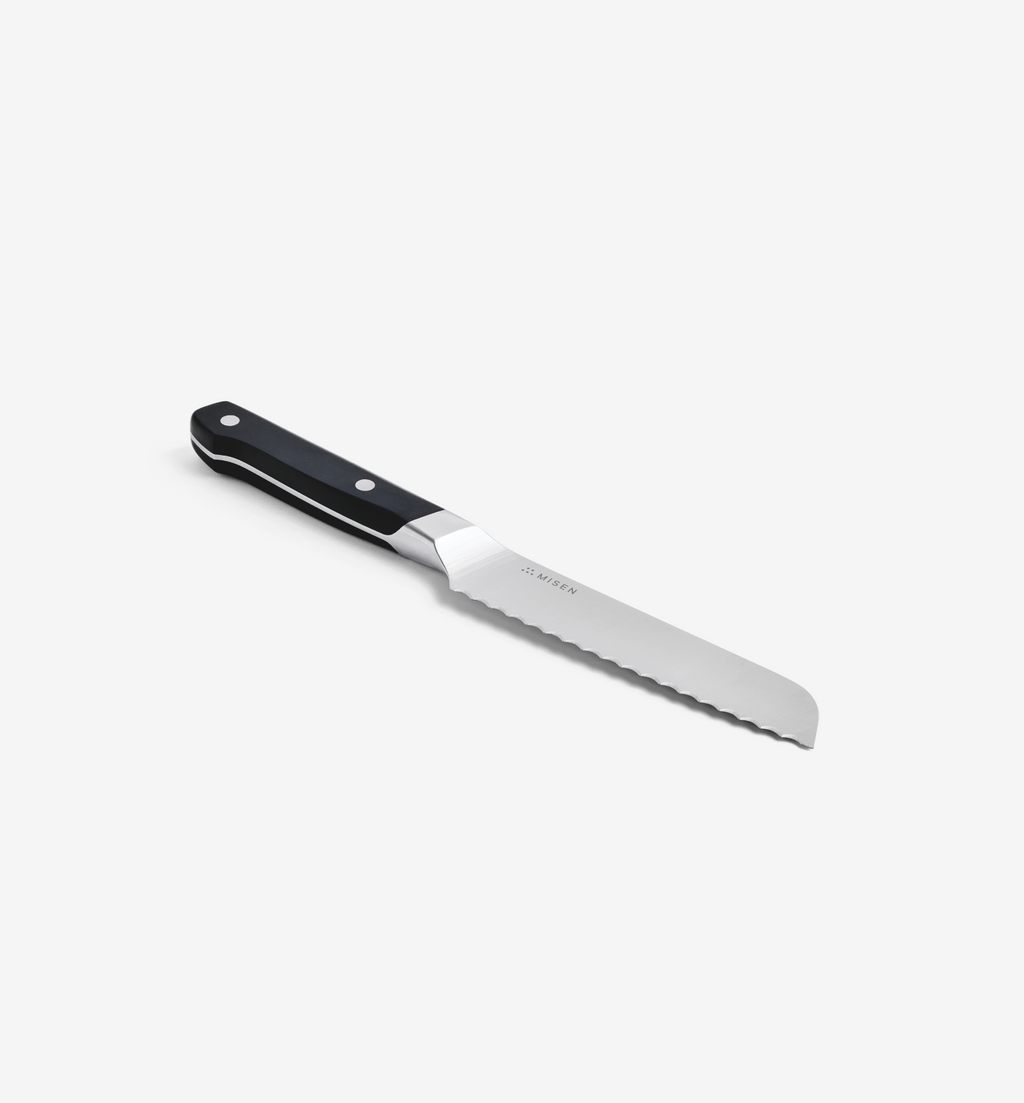 Misen serrated utility knife with black handle and stainless steel blade
