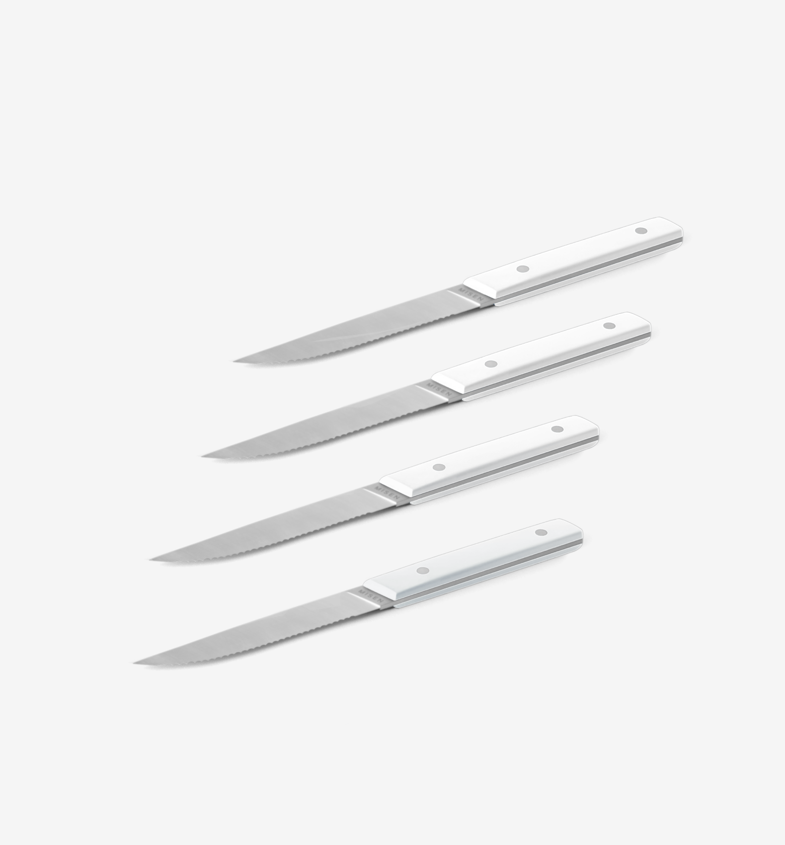 Set of 4 steak knives with white handles and serrated stainless steel blades