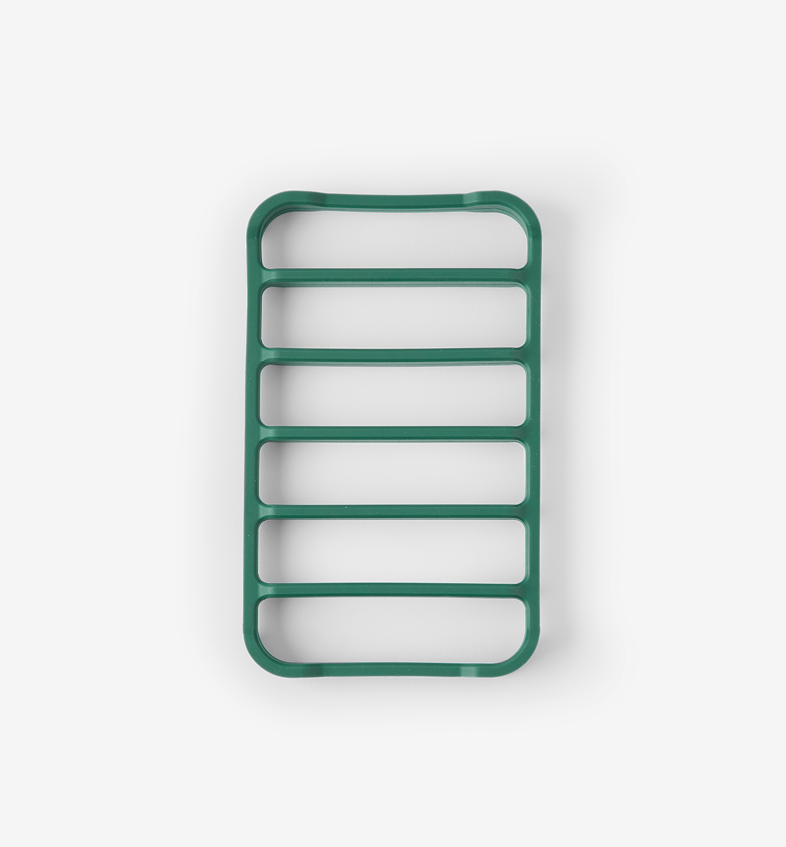 Green silicone trivet with six horizontal slots for heat protection