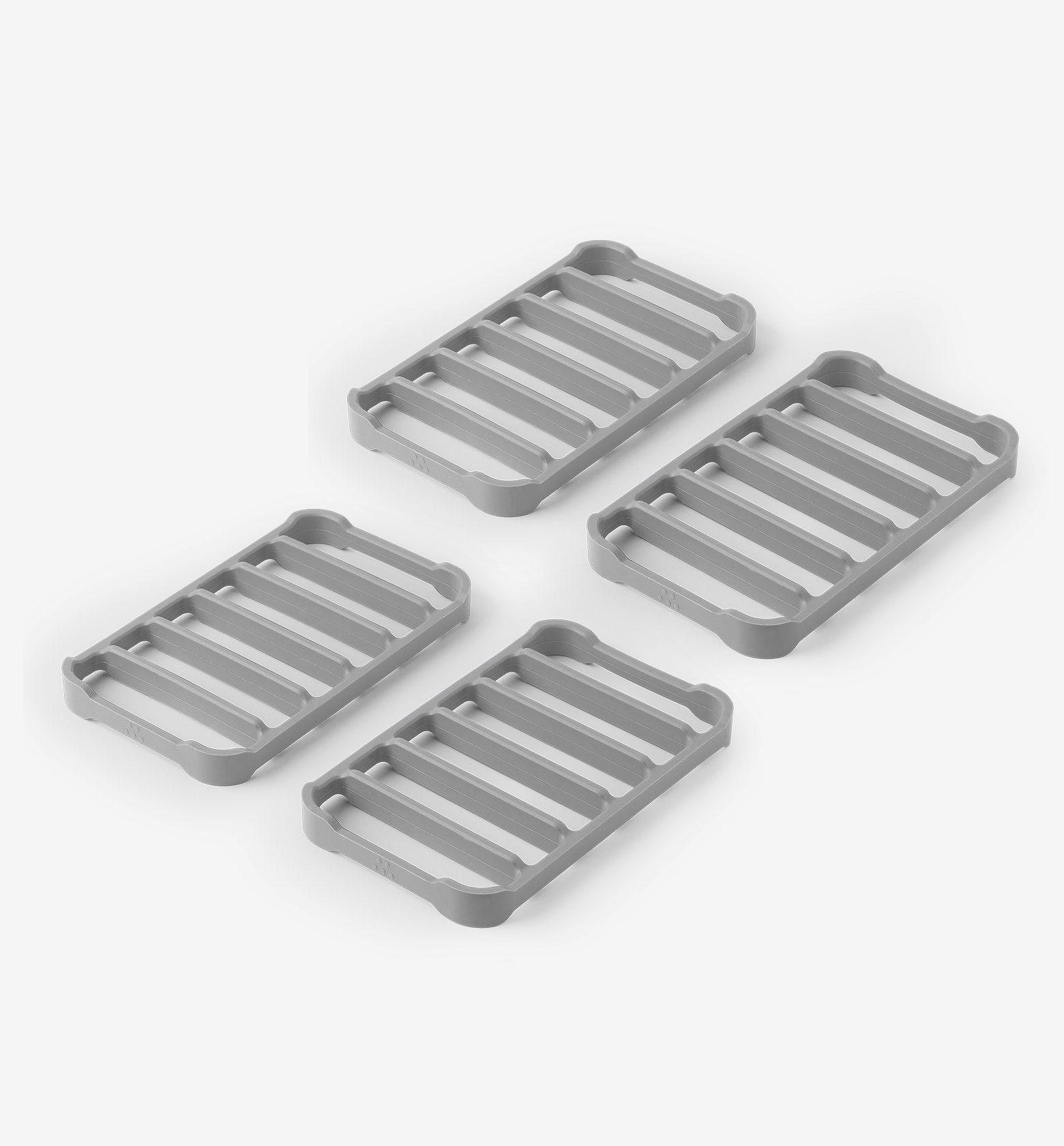 Set of 4 gray silicone trivets with slatted design for heat protection