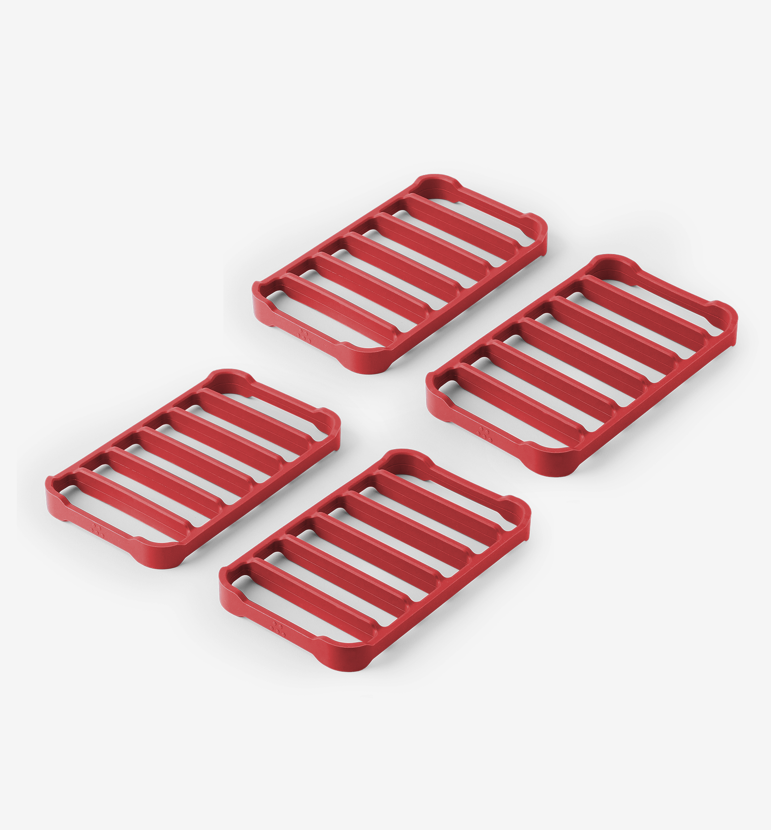 Set of 4 red silicone trivets with slatted grid design for hot pots and pans