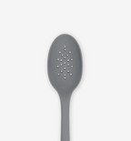 Gray silicone slotted spoon with perforated holes for draining