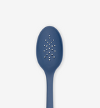 Blue silicone slotted spoon with perforated holes for draining