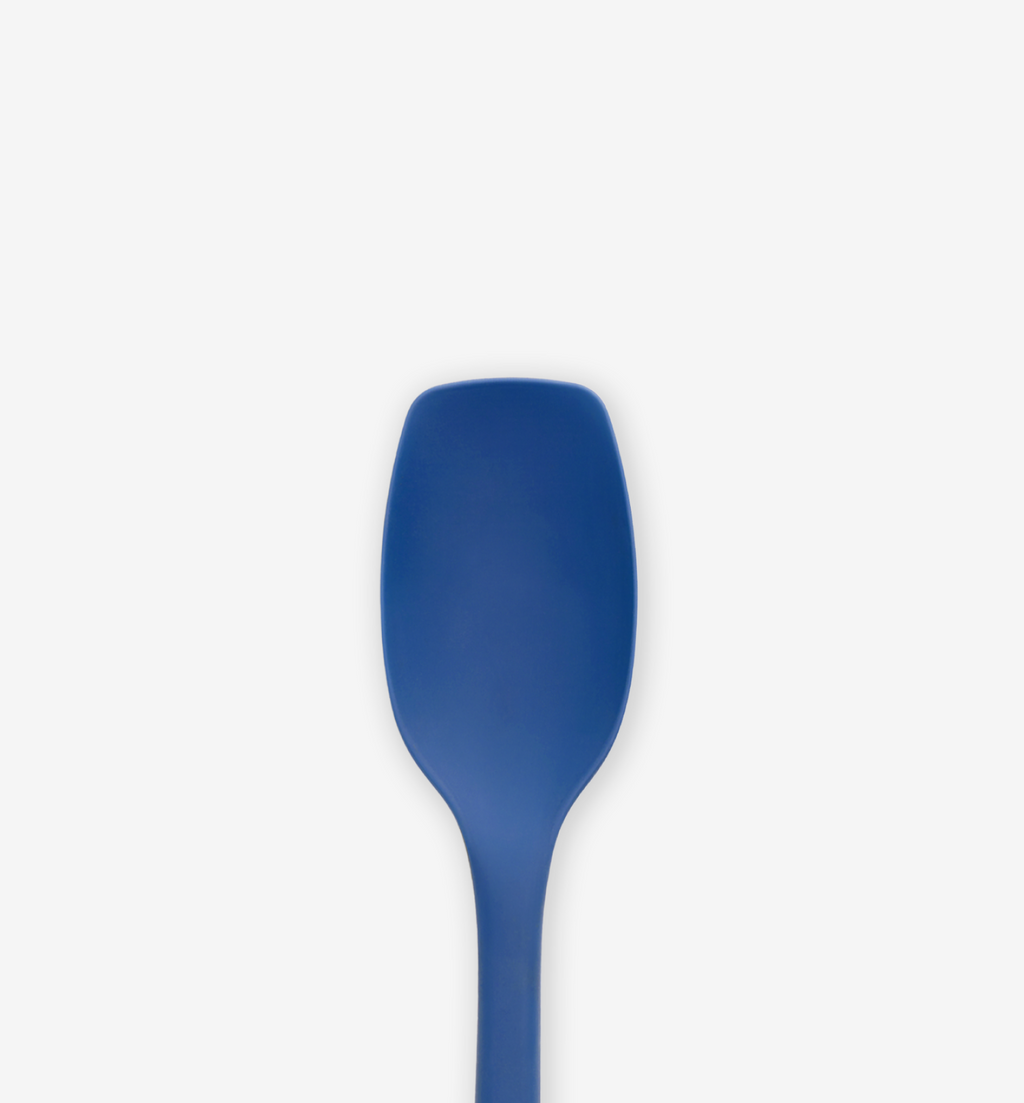 Blue silicone spatula head close-up with flexible wide blade