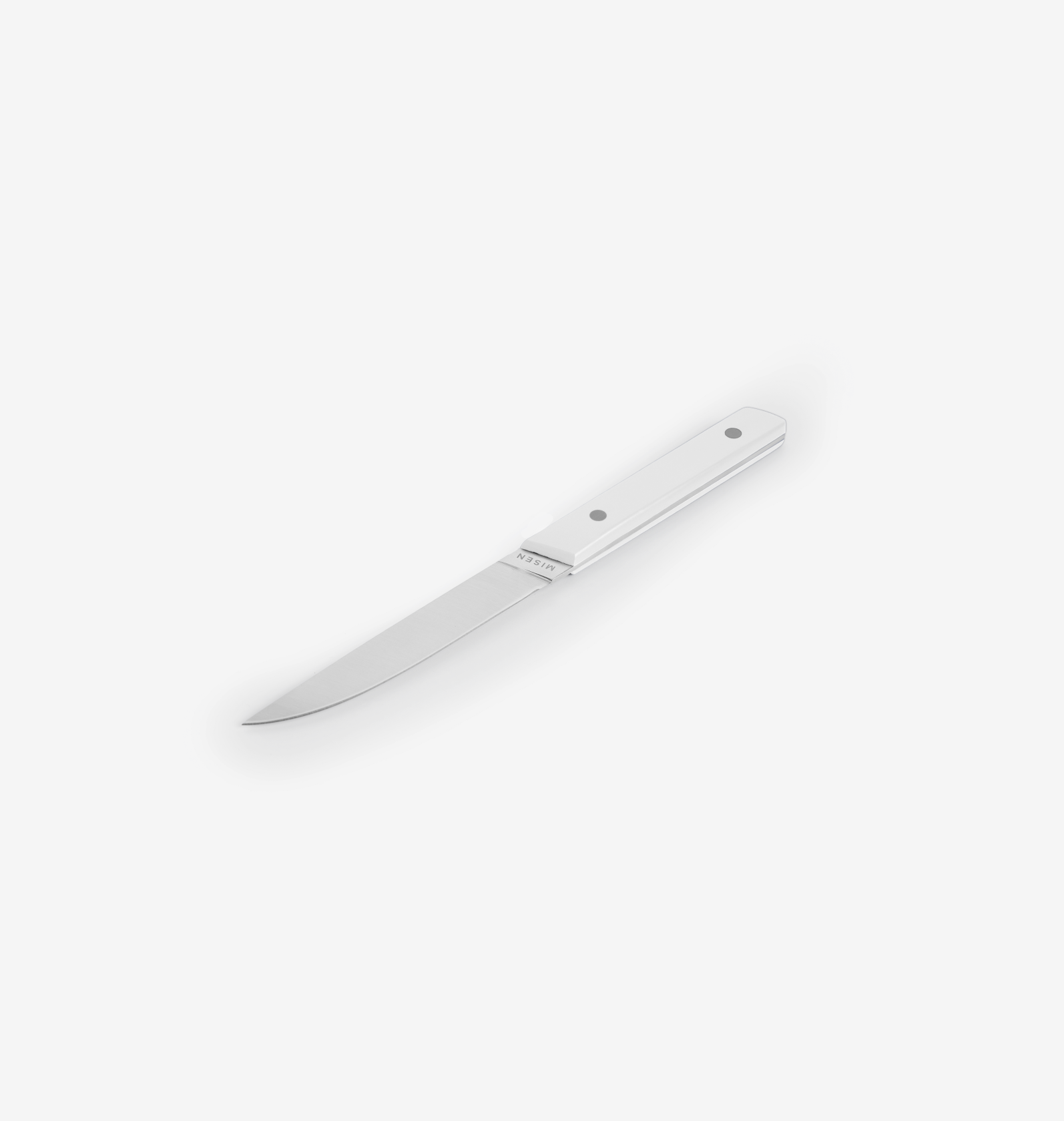 Misen steak knife with white handle and stainless steel blade