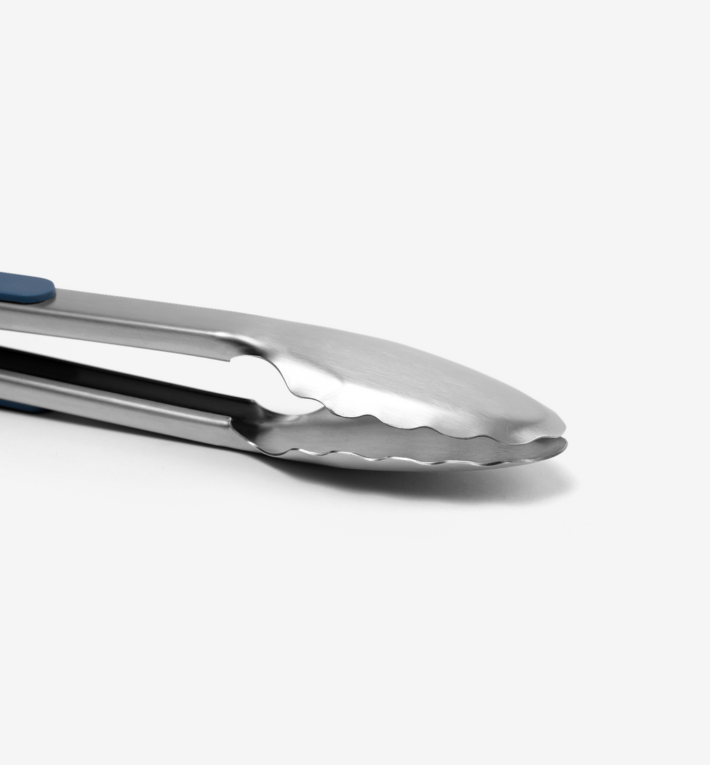 Stainless steel kitchen tongs with scalloped gripping edges and blue handle accent