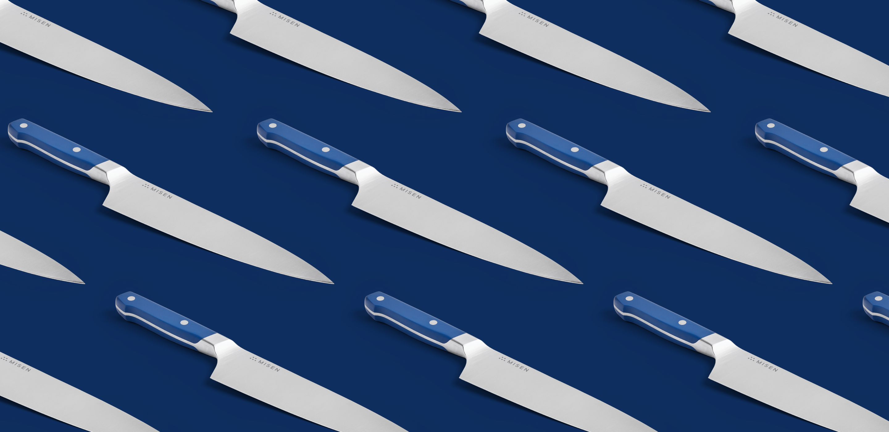 Misen chef's knife with blue handle on navy background