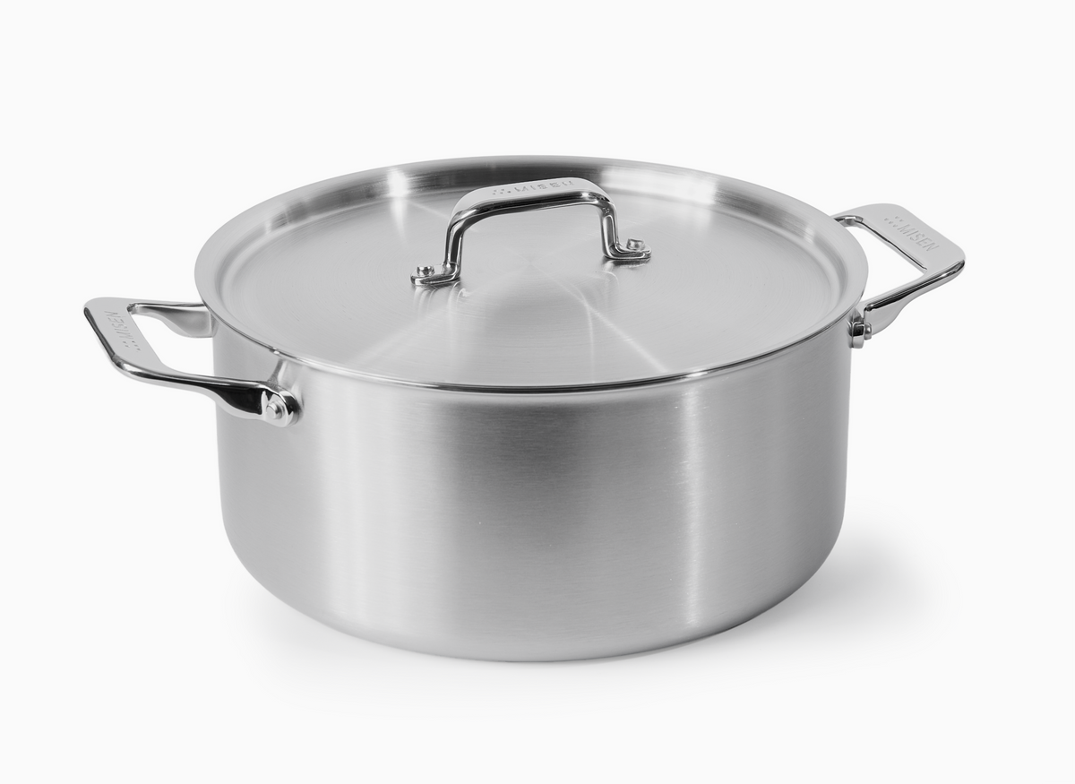 A Misen stainless steel Dutch oven with a lid and two handles.