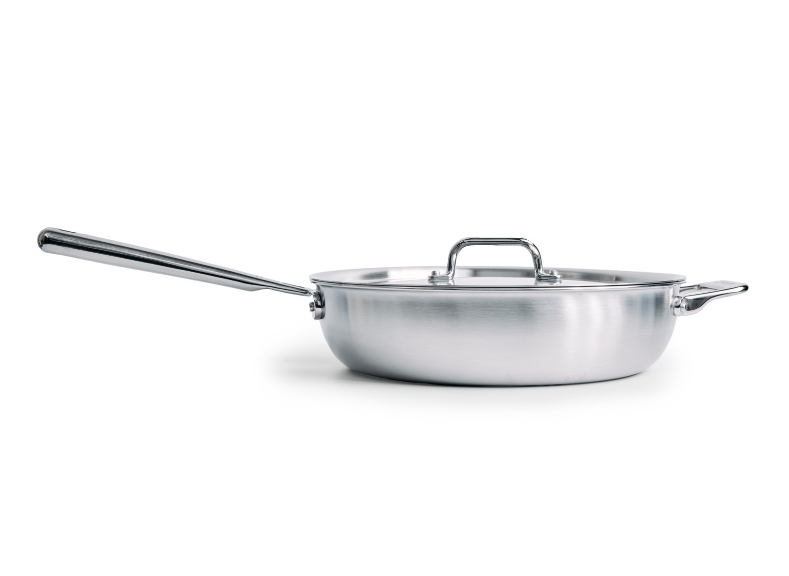 A low-angle, isolated shot of a Misen 4 QT stainless steel all-purpose pan with a lid is shown. The pan has a long main handle on the left and a small helper handle on the right.
