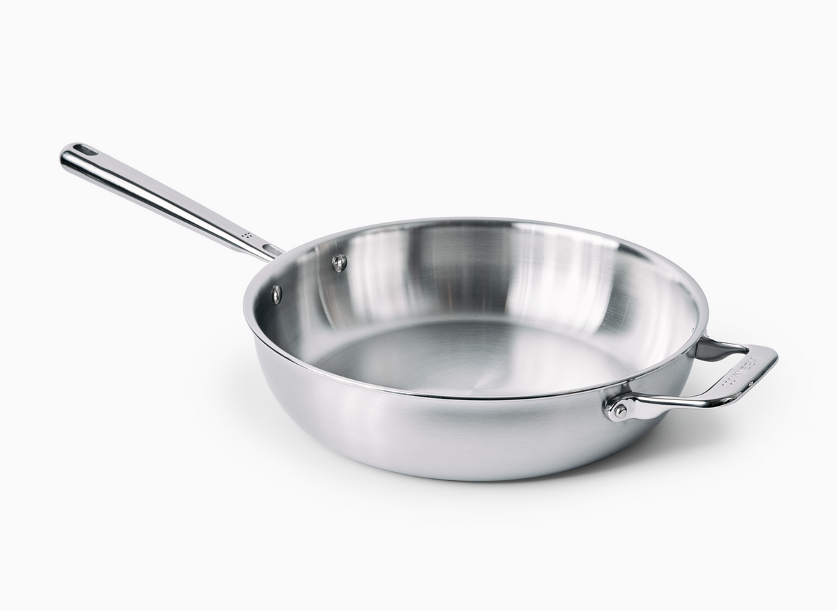 A Misen stainless steel 4 QT all-purpose pan is shown, featuring a long main handle and a smaller helper handle on the opposite side.