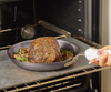 Baking a pot roast in a Misen Pre-Seasoned Carbon Steel Pan atop two Misen Oven Steels.