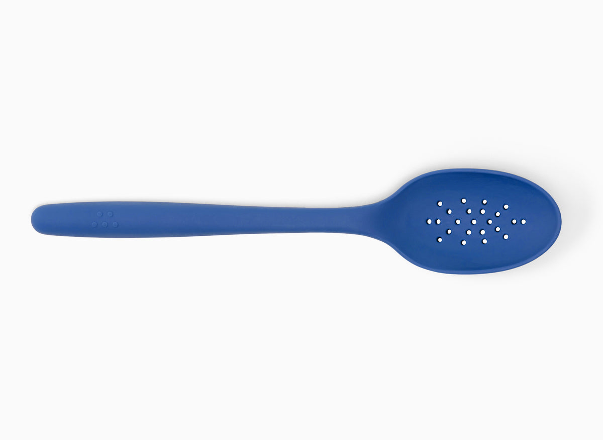 A Blue Misen Slotted Spoon seen from above on a white background.