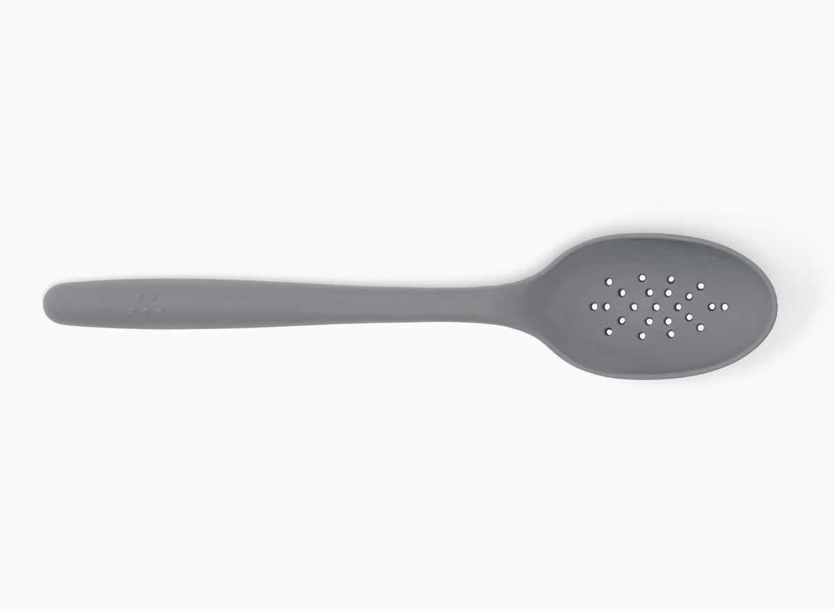A Gray Misen Slotted Spoon seen from above on a white background.