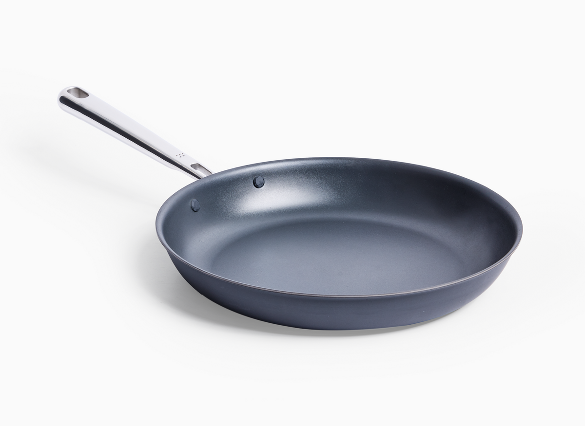 A 10 inch Misen Carbon Nonstick™ Frying Pan with a silver handle is shown on a white background, angled slightly to the right.
