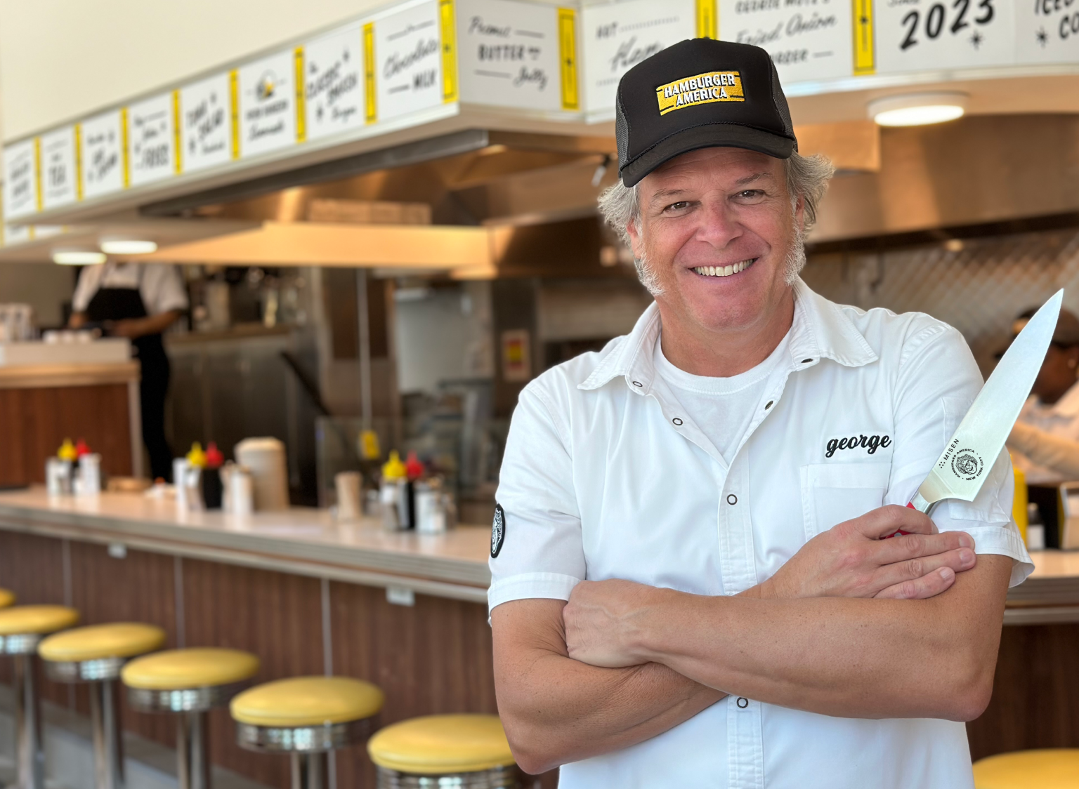 George Motz of Hamburger America holding his custom, limited edition Chef's Knife - only at Misen!