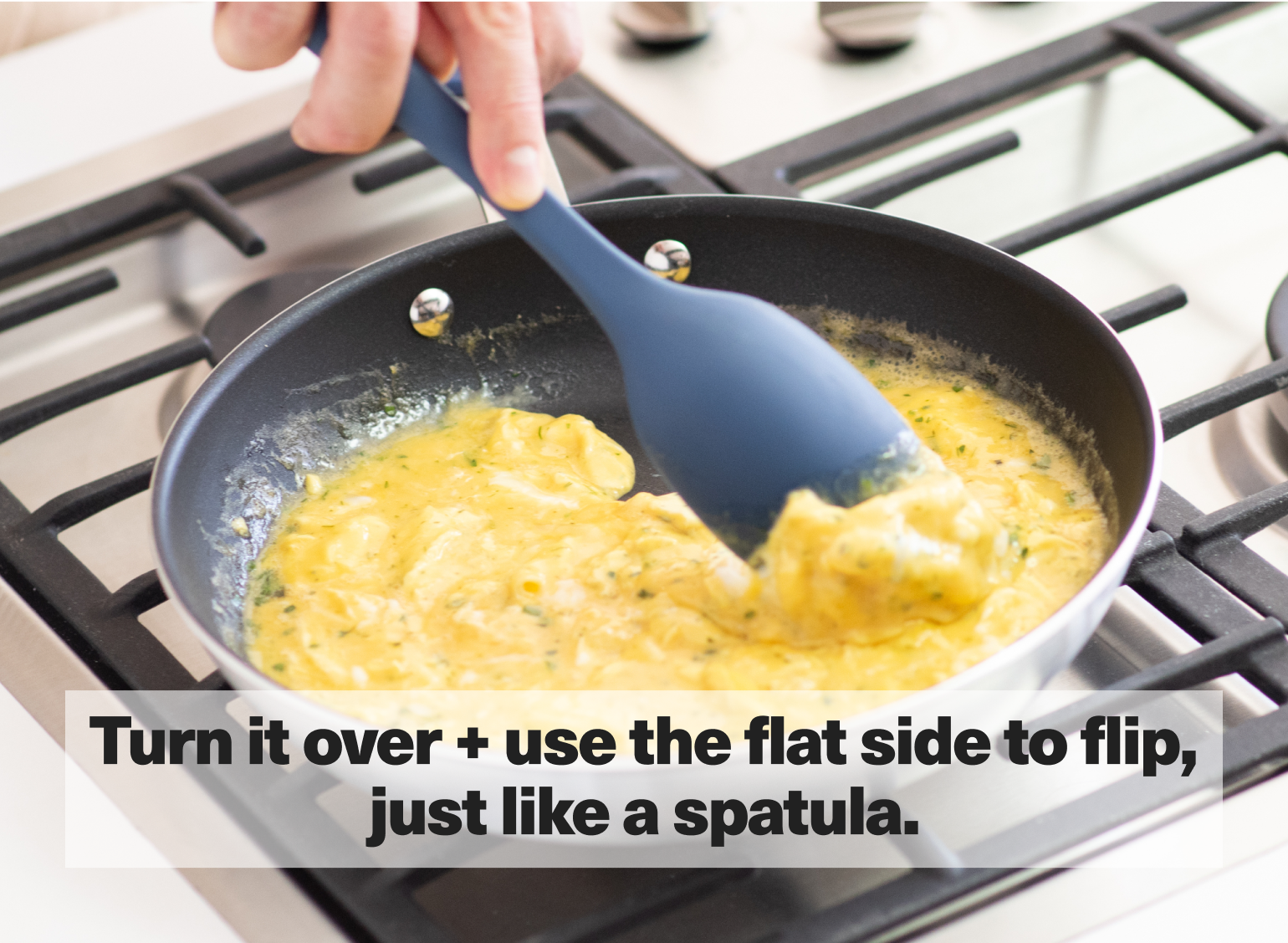 Turn it over + use the flat side to flip, just like a spatula.